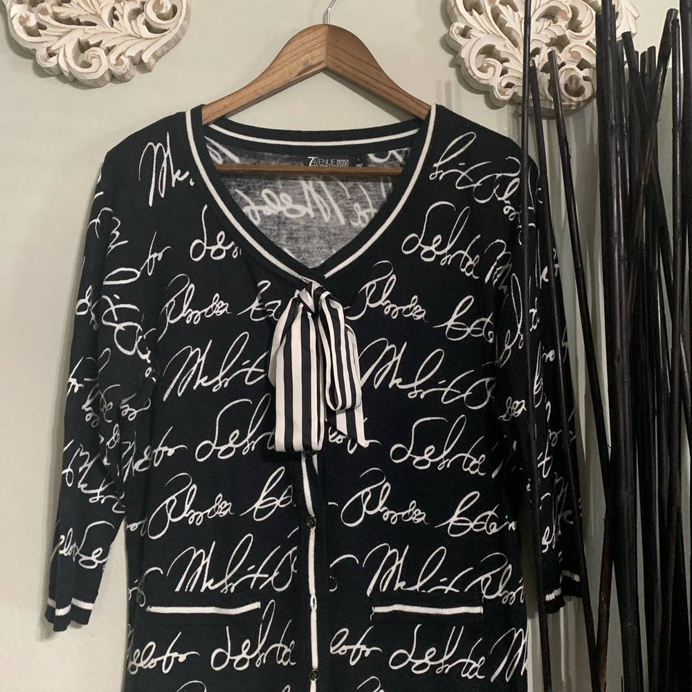 New York & Co. cardigan with bow and writing detail.